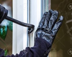 80028967-a-burglar-is-going-to-break-into-a-house